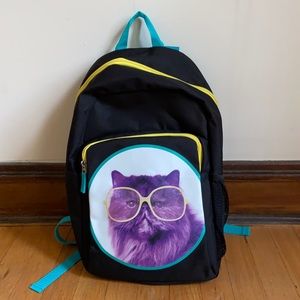 Cat wearing glasses backpack